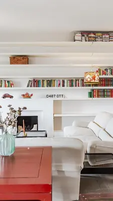 a living room with a bed and a desk and books at Loft Piazza Vittorio - Zen 38 in Rome
