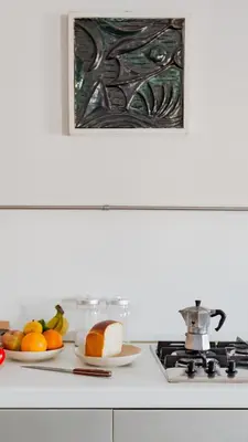 a kitchen counter with two plates of fruit and a stove at Loft Piazza Vittorio - Zen 38 in Rome