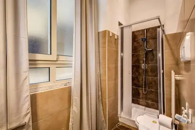 a bathroom with a shower and a toilet at GuestHouse o Affittacamere La civetta di Trastevere in Rome