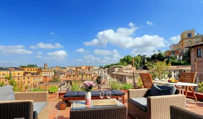 a balcony with a view of the city at Trastevere Penthouse amazing terrace in Rome