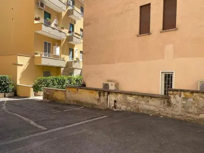 an empty parking lot in front of a building at Clodio Apartment in Rome