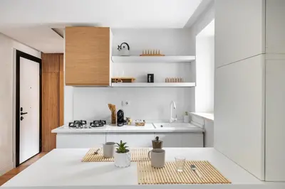 a white kitchen with a sink and a counter at NOH Vatican Studio in Rome