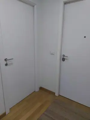 an empty room with two doors and a rug at Guest House San Pietro in Rome