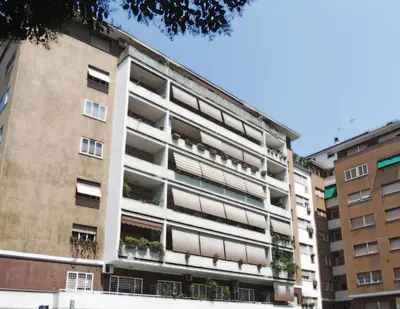 an apartment building with balconies and plants at Guest House San Pietro in Rome