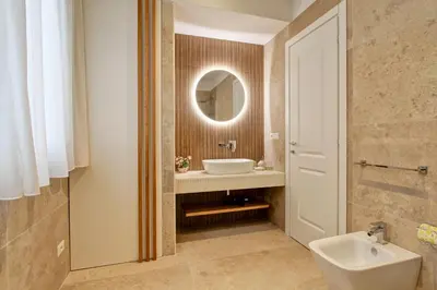 a bathroom with a sink and a mirror at SirtHouse in Rome