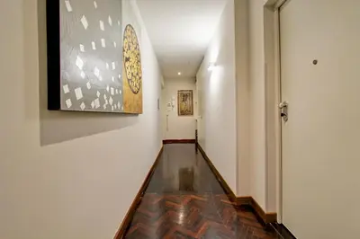 a hallway with a painting on the wall at SirtHouse in Rome