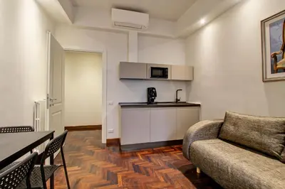 a living room with a couch and a table at SirtHouse in Rome
