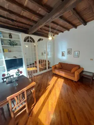a living room with a couch and a table at Home Piazza Dell'Orologio in Rome
