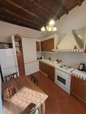 a kitchen with a table and a stove top oven at Home Piazza Dell'Orologio in Rome