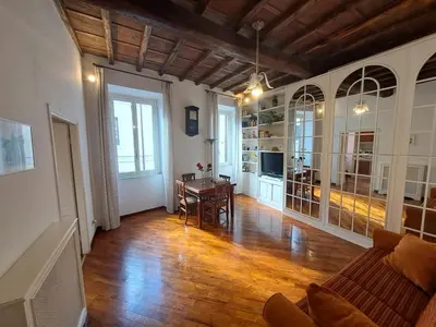 a living room with a couch and a table at Home Piazza Dell'Orologio in Rome