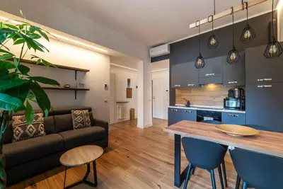 a living room with a couch and a table at CS Vatican Metro Apartment in Rome