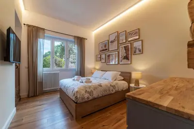 a bedroom with a bed and a window at CS Vatican Metro Apartment in Rome