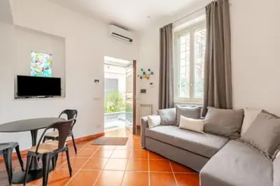 a living room with a couch and a table at Cottage San Giovanni in Rome
