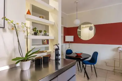 a kitchen with a table and a dining room at GuestHost - Aurea Domus Comfort suite in centro a Roma in Rome