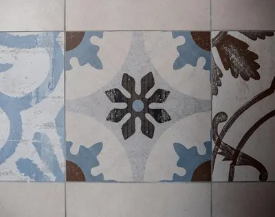 a blue and white tile floor in a bathroom at Campo Marzio Charming in Rome