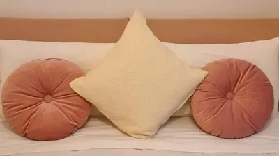 a star pillow and pillows on a bed at Il Cortile del 900 in Rome
