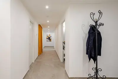 a hallway with an umbrella hanging on a wall at Design Apt Moderno Pzz del Popolo - Parking in Rome