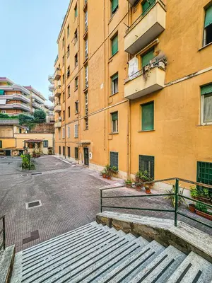 an empty street in front of a building at Mami Apartment in Rome