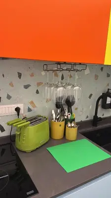 a kitchen counter with utensils in containers on a counter top at GALAXY By ROMEI in Rome