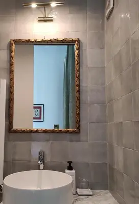 a bathroom with a white sink and a mirror at B&B Colori di Roma in Rome