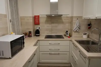 a kitchen with a sink and a stove top oven at Casa Giovanna in Rome