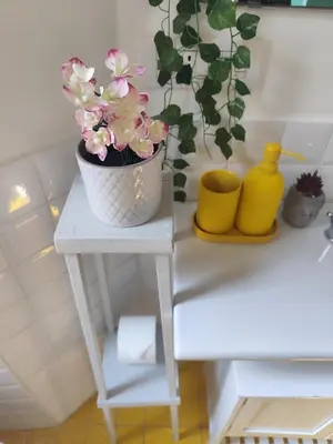 a white table with a potted plant on it at Colosseum Studio Flat blue in Rome