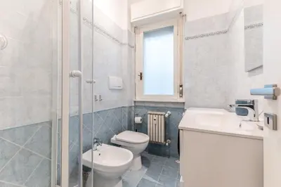 a bathroom with a toilet and a sink at Zampieri Loft in Rome