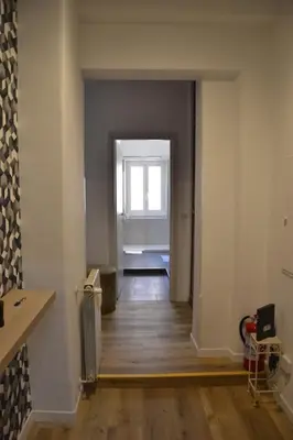 an empty room with a hallway with a window at Il Rifugio dell Inventore in Rome