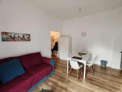 a living room with a couch and a table at Domus MT481 in Rome