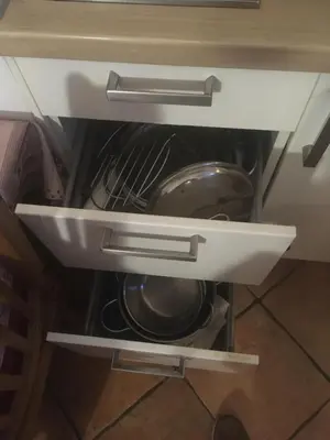 a drawer in a cabinet with a pot in it at Vacanze al Colosseo Polveriera in Rome