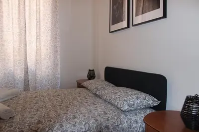 a bedroom with a bed with a pillow on it at Tiberim, Centro Storico in Rome