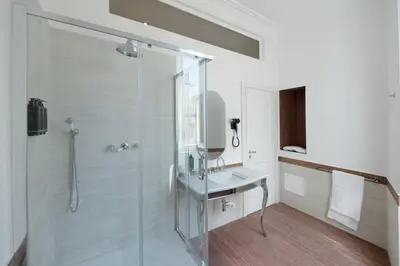 a bathroom with a shower and a sink at AGH Babuino in Rome