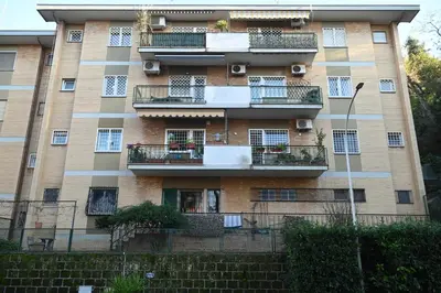 an apartment building with balconies and plants on it at Vatican Firefly House in Rome