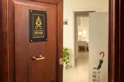 a door with a sign on it in a room at La Casina Vaticana in Rome
