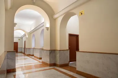 a hallway of a building with arched ceilings and a hallway sidx sidx at La Casina Vaticana in Rome
