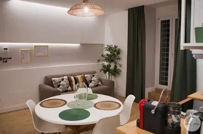 a living room with a table and a couch at Pon Pon Sweet Home in Rome
