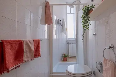 a bathroom with a shower and a toilet and a tub at La Casetta di San Giovanni in Rome