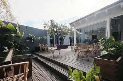 a deck with chairs and tables on a house at Le Arcate, suite 1 Lavinia, suite 2 Lucilla in Rome