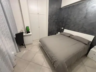 a bedroom with a bed and a desk in it at Guest House Vatican Room da Gabry in Rome