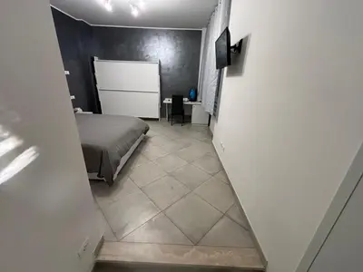 a bedroom with a bed and a hallway with a floor at Guest House Vatican Room da Gabry in Rome