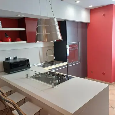 a kitchen with a counter with a sink and a stove at Apt Osci in Rome