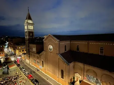 a large building with a clock tower on top of it at Apt Osci in Rome