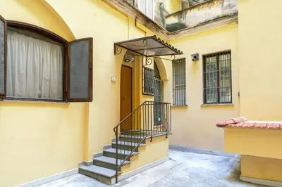 a building with a staircase in front of a door at Stylish Studio in Sallustiano in Rome