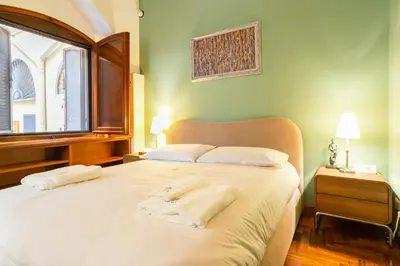 a bedroom with a large bed with towels on it at Stylish Studio in Sallustiano in Rome