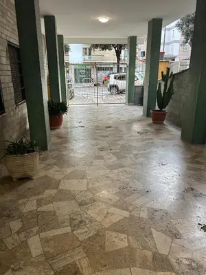 an empty hallway with potted plants in a building at Be Max Guest House in Rome