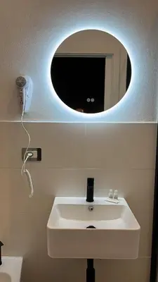 a bathroom with a white sink and a mirror at Be Max Guest House in Rome