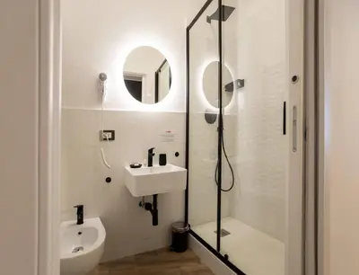a bathroom with a sink and a shower at Be Max Guest House in Rome