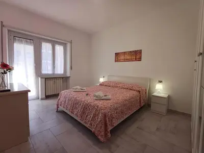 a bedroom with a bed with two towels on it at Alessia C Locazione turistica in Rome
