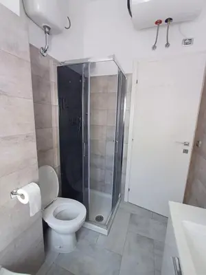 a bathroom with a shower and a toilet in it at Alessia C Locazione turistica in Rome