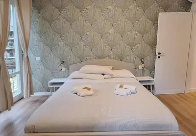 a bedroom with a large bed with towels on it at Casa Monteverde near Trastevere and the city center in Rome